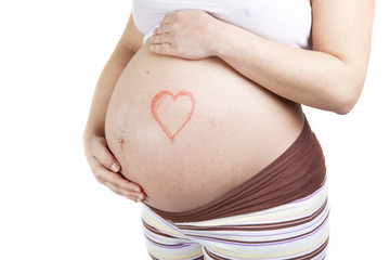 Pregnant woman belly with heart drawn