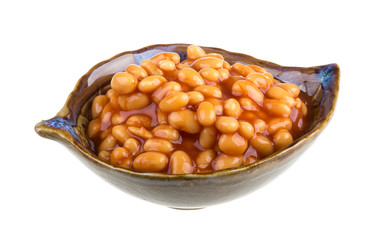 Marinated haricot beans in tomato sauce with shallots on a plate