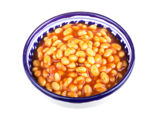 Marinated haricot beans in tomato sauce with shallots on a plate