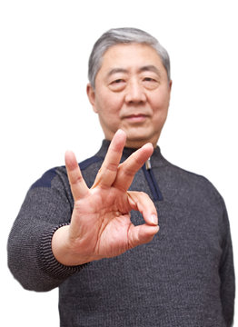 Senior asian man showing finger gesture
