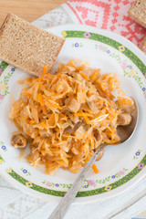 Cabbage stew with mushrooms on plate