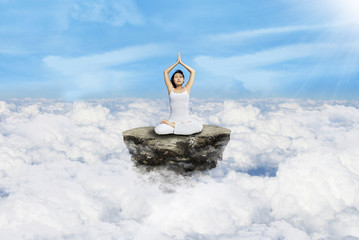 Meditation yoga above clouds