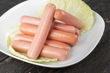 Fresh sausages on a plate