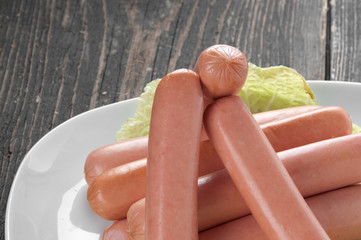 Fresh sausages on a plate