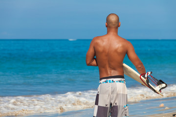 young man with surfboard