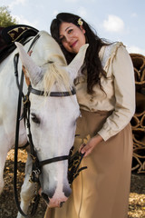 classical girl with a white horse