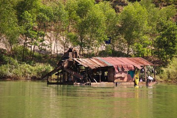 Fototapeta na wymiar Housing boat on the river Perfume in Vietnam
