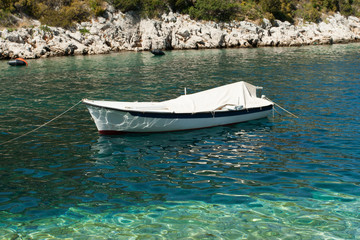 Fototapeta na wymiar Small white boat on the sea