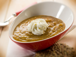 lentils cream soup with yogurt cream, selective focus