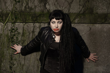 Gothic girl on cemetery.