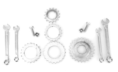 Machine gear, metal cogwheels, nuts and bolts isolated on white