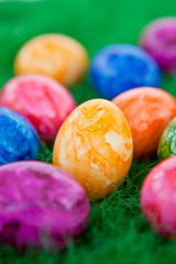 Colorful easter eggs on green