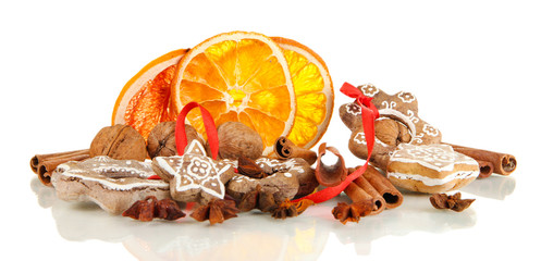 Dried citrus fruits, spices and cookies isolated on white