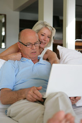 Senior couple with a laptop