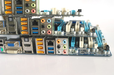 Back side of three computer main boards