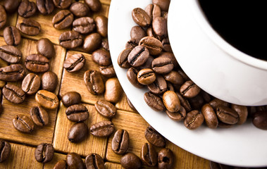 Coffee cup with fresh coffe beans for breakfast
