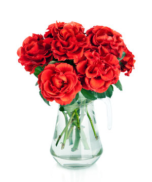 Huge bunch of red roses flowers  in jug isolated on white