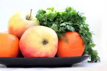 Apples, tangerines and greens.