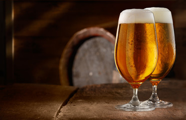Two glasses of fresh foamy beer