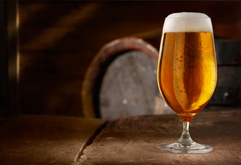 Closeup of a glass of fresh foamy beer