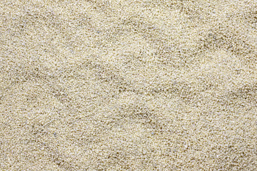Sand and pebbles closeup background texture
