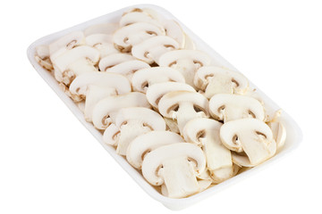 cut champignons in white box on white background