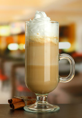 Fragrant coffee latte in glass cup with vanilla pods,
