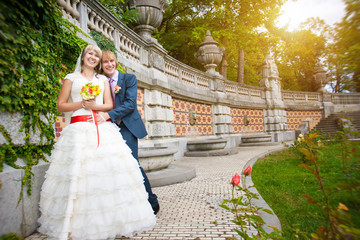 Fototapeta premium happy couple are hugging near the ancient architectural wall