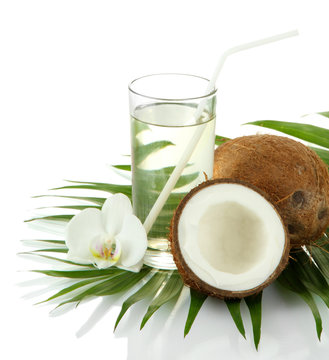 Coconuts with glass of milk, isolated on white
