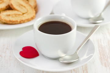 cup of coffee with cookies