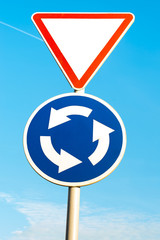 two road sign on blue sky