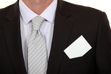 close-up on business card on businessman's suit