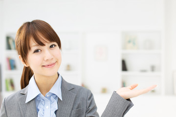 Beautiful young businesswoman working in office