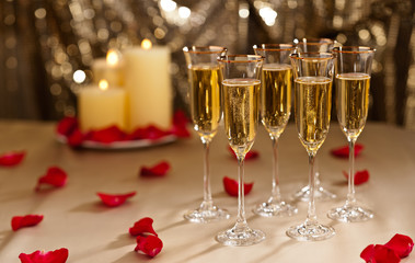 Gold glitter Wedding reception setting with champagne