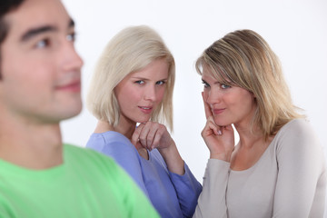 Women observing a man