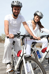 young couple on bicycle
