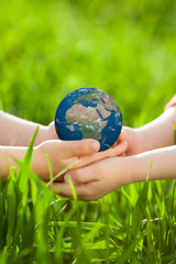 Earth in children`s hands