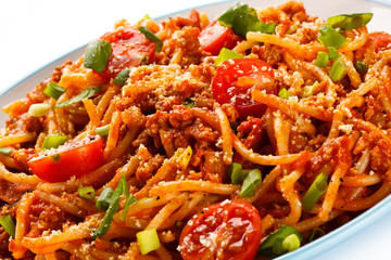Pasta with meat, tomato sauce, parmesan and vegetables