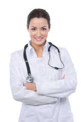 Beautiful brunette doctor smiling at the camera with her arms fo