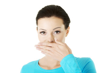 Woman covering mouth with hand