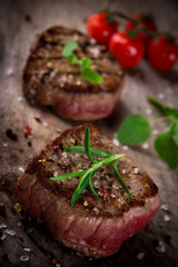 Grilled bbq steak on wooden background