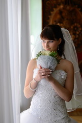 The bride look at window