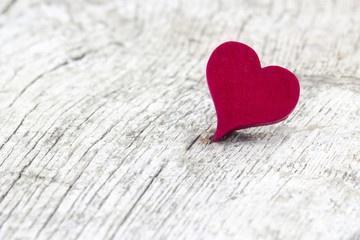 red heart on wooden background