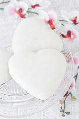 cookies with icing in the form of heart on a glass base