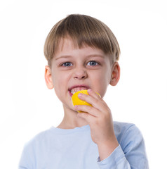 boy eating lemon