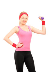 Young female exercising with a dumbell