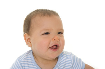 Adorable happy baby boy in the studio