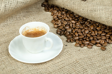 Cup of coffee and coffee beans