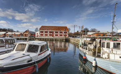 Fototapeta na wymiar Lundeborg harbor in Denmark with half-timbered houses