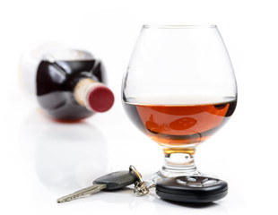 glass of alcohol and car keys